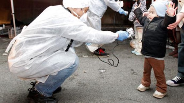 Child w 'Hands Up' Being Measured, gear-radiation-koriyama-daini.si
